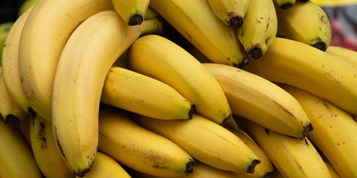 ripe yellow bananas at the shopping market fruits that are good for health the concept of vegetarianism, veganism and raw food vegetarian, vegan and raw food and diet food background, bright color retail sale of seasonal products