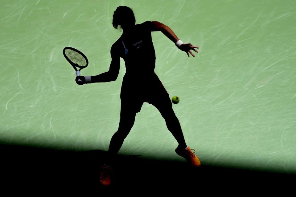 Zheng Qinwen, of China, returns a shot to Aryna Sabalenka, of Belarus, during the quarterfinals of the U.S. Open tennis championships, Wednesday, Sept. 6, 2023, in New York. (AP Photo/Mary Altaffer)