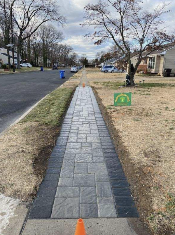 stone walkway with cones to caution for slips