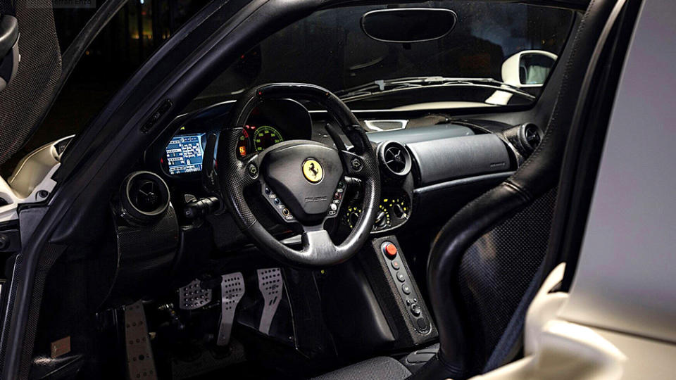 The interior was commissioned to feature black leather, red instruments and seat belts and wider carbon-fiber bucket seats with black cloth inserts. - Credit: RM Sotheby's