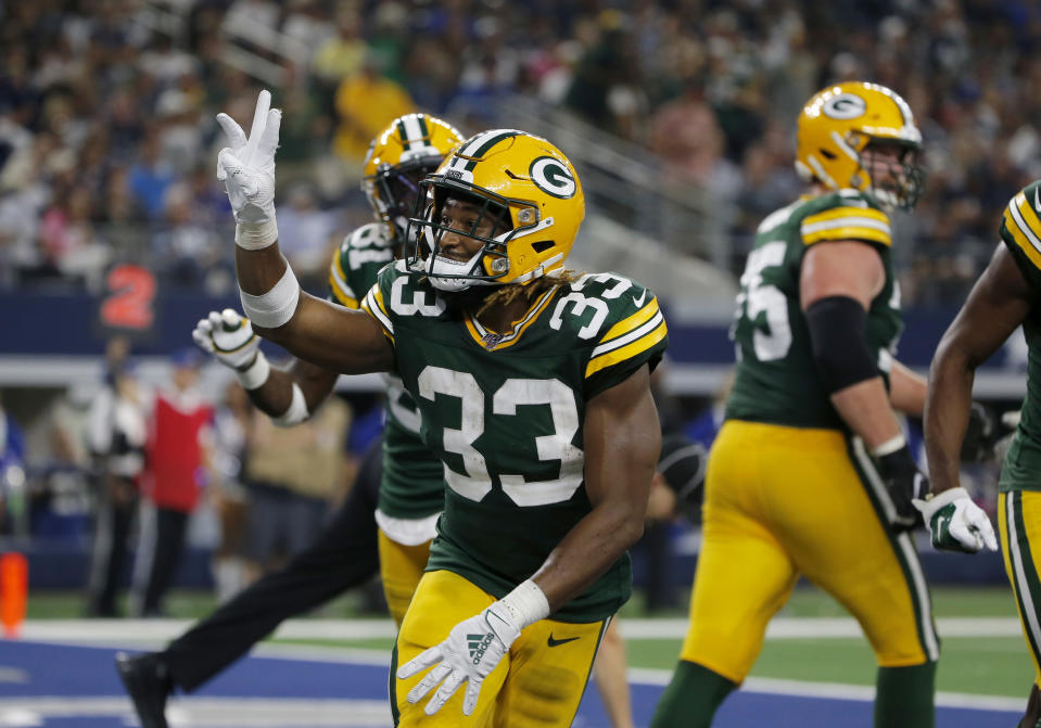 Green Bay Packers' Aaron Jones (33) celebrates his touchdown against the Dallas Cowboys during the second half of an NFL football game in Arlington, Texas, Sunday, Oct. 6, 2019. (AP Photo/Michael Ainsworth)