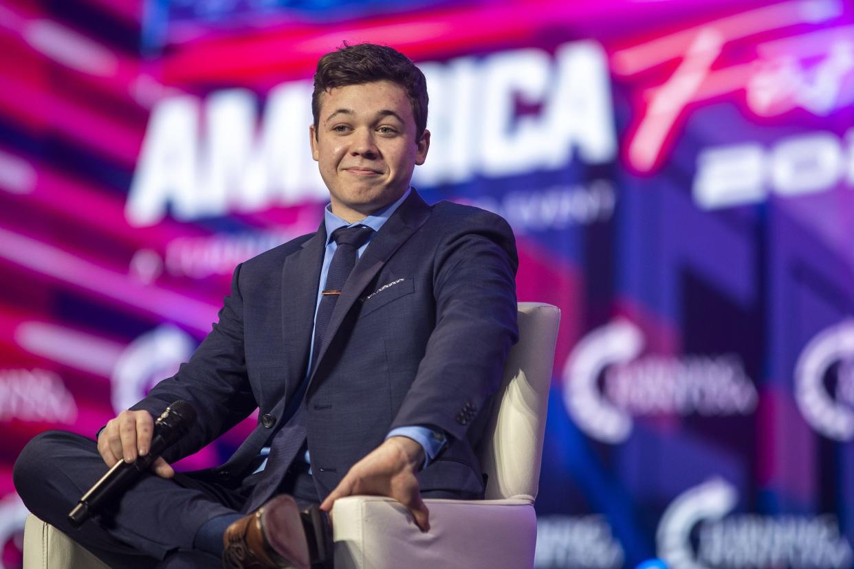 Kyle Rittenhouse listens to the crowd cheer at a Turning Point USA event in December 2021. The group is bringing Rittenhouse to WKU this week.