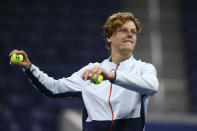 Jannik Sinner, of Italy, throws tennis balls to the crowd after beating Ilya Ivashka, of Belarus, during the fourth round of the U.S. Open tennis championships, Monday, Sept. 5, 2022, in New York. (AP Photo/Andres Kudacki)