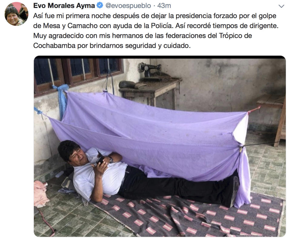 This screen grab of a tweet posted on the account of Bolivia's former President Evo Morales on Monday, Nov. 11, 2019, shows him lying on the floor at an undisclosed location and a text that reads in Spanish "This was my first night after leaving the presidency forced by a coup by Mesa and Camacho with the help of the police. I remembered my times as leader. I'm grateful to my brothers from the of Cochabamba tropic's federations for providing us with security and care." Morales resigned to the presidency on Nov 10, under mounting pressure from the military and the public after a disputed re-election victory that triggered weeks of fraud allegations and deadly protests. (AP Photo)