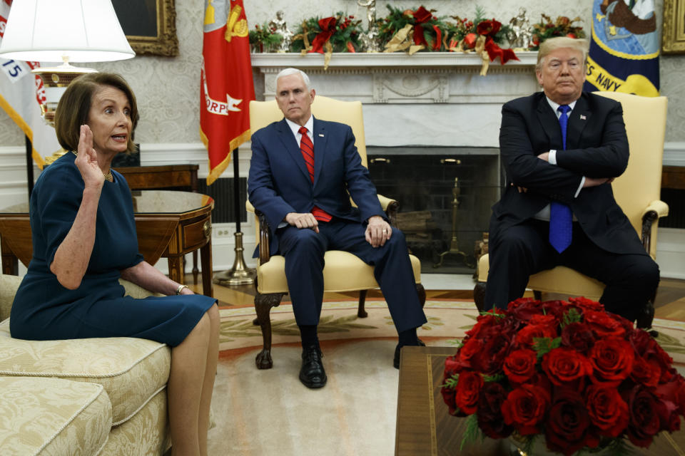 FILE - In this Tuesday, Dec. 11, 2018 file photo, Vice President Mike Pence, center, listens as President Donald Trump argues with House Minority Leader Rep. Nancy Pelosi, D-Calif., during a meeting in the Oval Office of the White House, in Washington. Across the world, people are questioning truths they had long held to be self-evident, and they are dismissing some of them as fake news. They are replacing traditions they had long seen as immutable with haphazard reinvention. In the United States, a president who some accuse of upending ideals that the nation holds dear is aggressively abandoning protocol and customs that have prevailed through a dozen of his predecessors. (AP Photo/Evan Vucci, File)