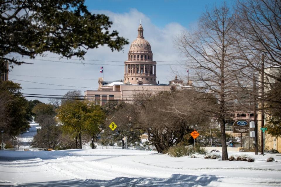 AUSTIN, TX – FEBRUARY 15: The Texas Capitol is surrounded by snow in on February 15, 2021 in Austin, Texas. Winter storm Uri has brought historic cold weather to Texas, causing traffic delays and power outages, and storms have swept across 26 states with a mix of freezing temperatures and precipitation. (Photo by Montinique Monroe/Getty Images)
