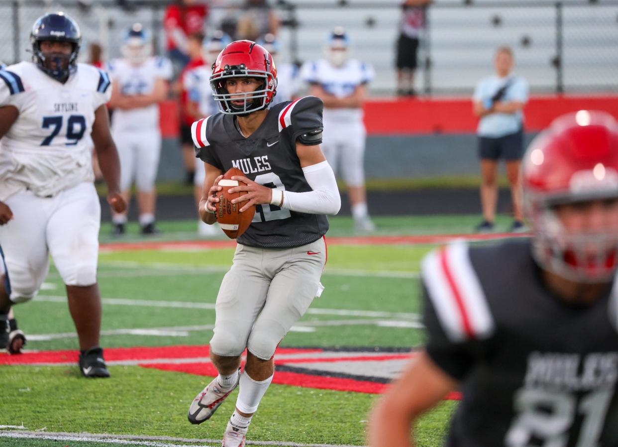 Bedford quarterback Drew Logsdon looks for a receiver during a 24-14 win over Ann Arbor Skyline Friday.