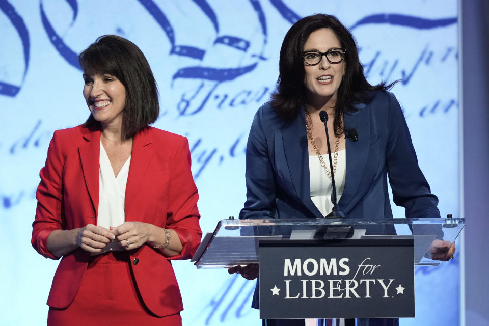 FILE - Moms for Liberty co-founders Tina Descovich, left, and Tiffany Justice, speak at the Moms for Liberty meeting in Philadelphia, Friday, June 30, 2023. (AP Photo/Matt Rourke, File)