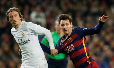 Football Soccer - FC Barcelona v Real Madrid - La Liga - Camp Nou, Barcelona - 2/4/16 Barcelona's Lionel Messi and Luis Suarez in action with Real Madrid's Luka Modric Reuters / Albert Gea Livepic