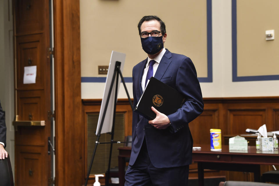 Treasury Secretary Steven Mnuchin arrives for a House Select Subcommittee on the Coronavirus Crisis during a hybrid hearing, Tuesday, Sept. 1, 2020, on Capitol Hill in Washington (Nicholas Kamm/Pool via AP)