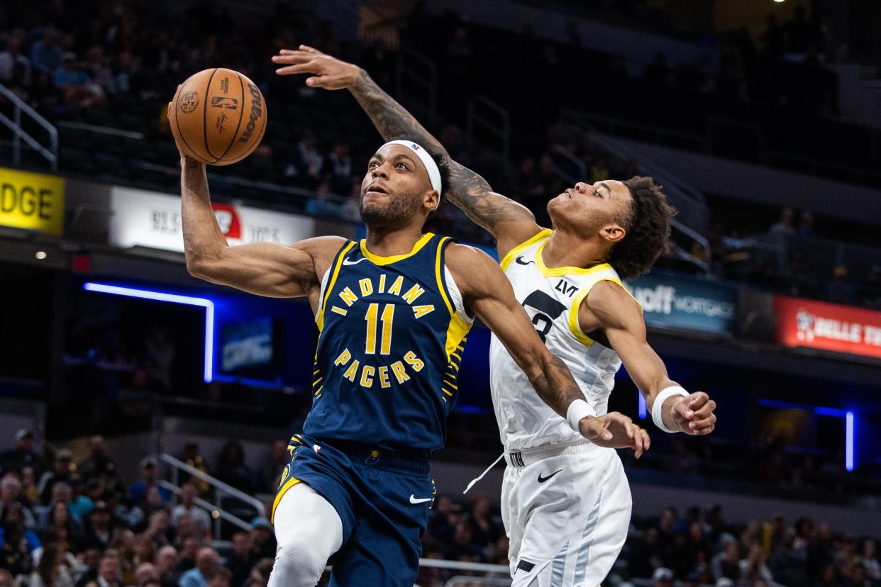 Nov 8, 2023; Indianapolis, Indiana, USA; Indiana Pacers forward Bruce Brown (11) shoots the ball while Utah Jazz guard Keyonte George (3) defends in the second half at Gainbridge Fieldhouse. Mandatory Credit: Trevor Ruszkowski-USA TODAY Sports