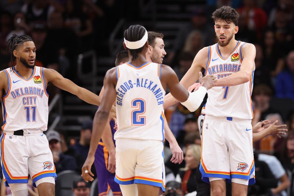 PHOENIX, ARIZONA - MARCH 03: Chet Holmgren #7 of the Oklahoma City Thunder high fives Shai Gilgeous-Alexander #2 after scoring during the first half of the NBA game at Footprint Center on March 03, 2024 in Phoenix, Arizona. NOTE TO USER: User expressly acknowledges and agrees that, by downloading and or using this photograph, User is consenting to the terms and conditions of the Getty Images License Agreement. (Photo by Christian Petersen/Getty Images)