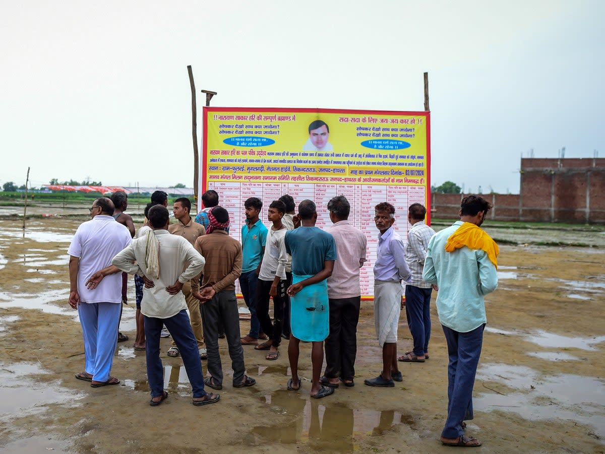 People walk around the venue of the stampede a day after it occurred on 3 July 2024 in Hathras, India (Getty)