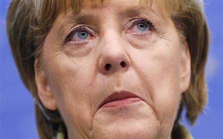 Germany's Chancellor Angela Merkel addresses a news conference during a European Union leaders summit in Brussels June 28, 2013. REUTERS/Francois Lenoir