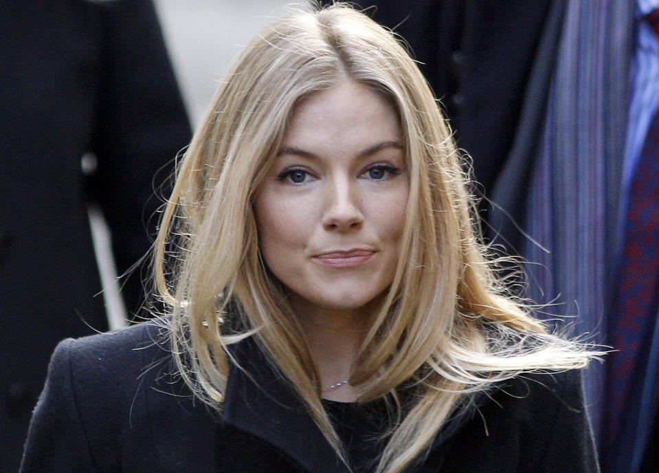 FILE- This Thursday, Nov. 24, 2011 file photo shows British actress Sienna Miller, arriving to testify at the Leveson inquiry at the Royal Courts of Justice in central London. On Tuesday, July 24, 2012, British prosecutors announced charges against eight people alleged to have been involved in a phone hacking scheme with more than 600 targets. Some of the prominent alleged victims of the phone hacking are thought to have included, Paul McCartney, Heather Mills, Angelina Jolie, Brad Pitt, Jude Law, Sadie Frost, Sienna Miller, Wayne Rooney, Sven-Goran Eriksson, Lord Frederick Windsor, John Prescott, as well as murdered 13-year old school girl who was abducted in 2002 Amanda "Milly" Dowler. (AP Photo/Lefteris Pitarakis, FILE)