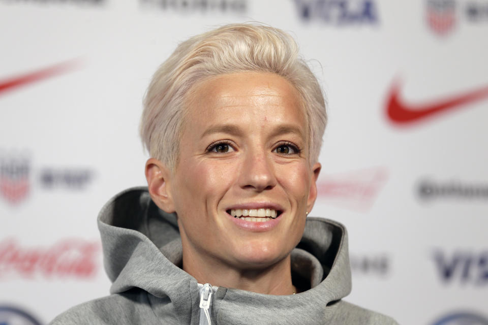 FILE - In this May 24, 2019, file photo, Megan Rapinoe, a member of the United States women's national soccer team, speaks to reporters during a news conference in New York. Seahawks quarterback Russell Wilson, soccer star Megan Rapinoe and three-time WNBA champion Sue Bird will preside over The ESPYS two-hour broadcast airing June 21 on ESPN. All three live in the Seattle area. Rapinoe and Bird are partners who share a household, which conveniently eases some logistics. Wilson’s singer-wife, Ciara, is likely to make an appearance, too. (AP Photo/Seth Wenig, File)