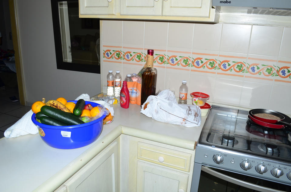CORRECTS TYPE OF LODGING - Food and drinks sit on a kitchen countertop in a high-rise condominium where famed drug boss Joaquin Guzman Loera "El Chapo" was arrested, in Mazatlan, Mexico, Saturday Feb. 22, 2014. At the moment of his arrest, Guzman was found with an unidentified woman, said one official not authorized to be quoted by name, adding that the U.S. Drug Enforcement Administration and the Marshals Service were "heavily involved" in the capture. No shots were fired. (AP Photo/El Debate de Mazatlan) MEXICO OUT, NO PUBLICAR EN MÉXICO