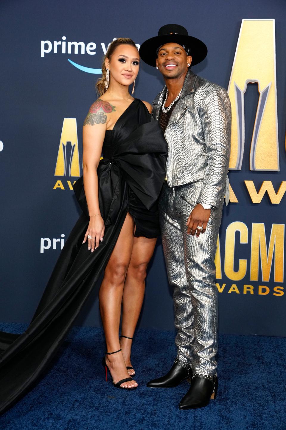 Jimmie Allen, right, and Alexis Gale arrive at the 57th Academy of Country Music Awards on Monday, March 7, 2022, at Allegiant Stadium in Las Vegas. (AP Photo/Eric Jamison) ORG XMIT: NVTV133