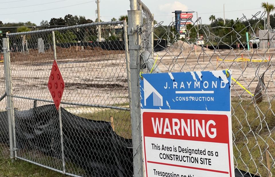 A newly erected construction fence surrounds the vacant site on the northwest corner of LPGA Boulevard and Technology Boulevard in Daytona Beach, next to the 104-pump Buc-ee's gas station/travel convenience center, on Saturday, Dec. 2, 2023. The Texas-based chain plans to build a 235-foot-long Buc-ee's Car Wash lated to open in either late summer or early fall 2024.