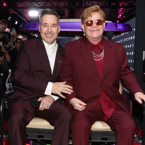 <p>Monica Schipper/Getty</p> David Furnish and Elton John.