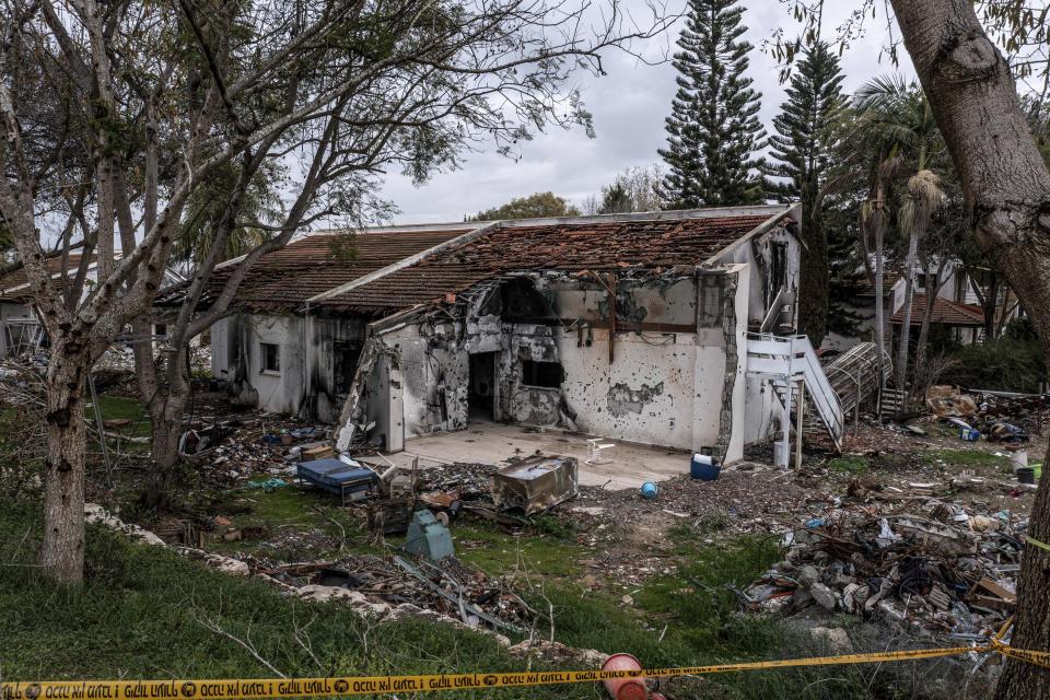 A battle-scarred home in Kibbutz Be'eri, an Israeli communal farm on the Gaza border, is seen Thursday, Jan. 11, 2024. Hamas held more than a dozen hostages in the home when it overran southern Israel on Oct. 7. At the end of an hours-long battle between the militants and Israeli forces, only two hostages survived, and relatives of the slain hostages now demand to know if their loved ones were killed by friendly fire from an Israeli tank. (AP Photo/Tsafrir Abayov)