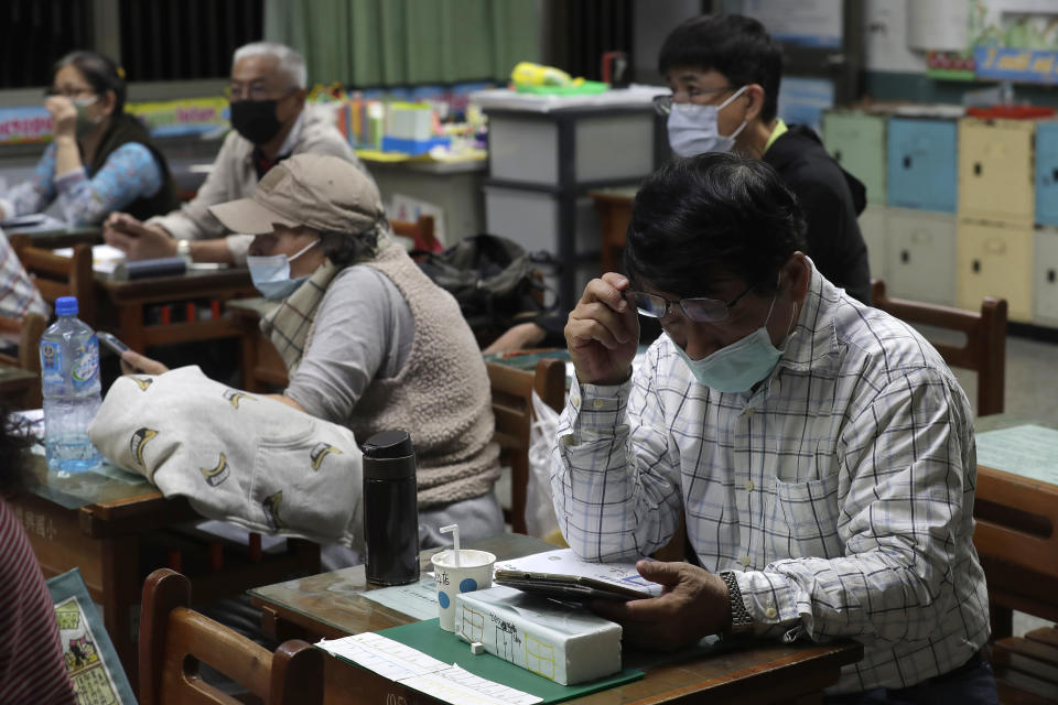 Students of Fake News Cleaner learn how to use the LINE app to identify fake news during a class in Kaohsiung City, southern Taiwan, Thursday, March 16, 2023. An anti-misinformation group in Taiwan called Fake News Cleaner has hosted more than 500 events, connecting with college students, elementary-school children — and the seniors that, some say, are the most vulnerable to such efforts. (AP Photo/Chiang Ying-ying)