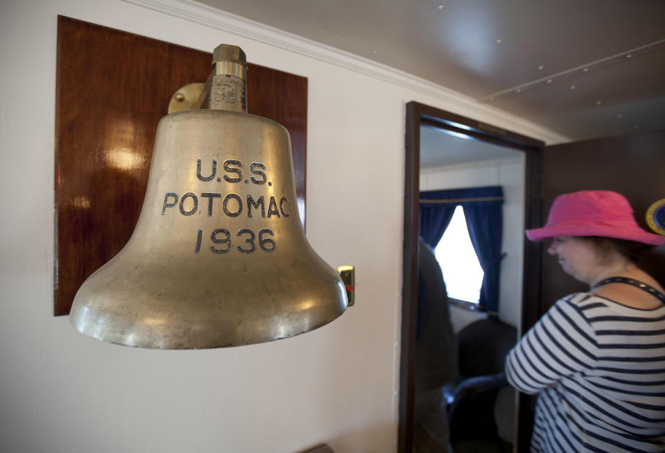 In this photo taken Wednesday July 4, 2012 a woman makes her way into President Franklin D. Roosevelt's bedroom aboard his "Floating White House," the USS Potomac, at Jack London Square in Oakland, Calif. It’s not easy being Oakland. Growing up in the shadow of an icon is never a shoe-in, whether you’re a wannabe princess related to that attention-grabbing vamp Cinderella or a city living next door to fabled San Francisco. (AP Photo/Eric Risberg)