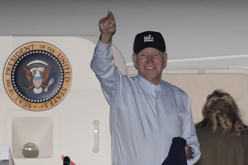 President Joe Biden gestures as first lady Jill Biden boards Air Force One at Andrews Air Force Base, Md., Tuesday, Nov. 23, 2021. (AP Photo/Luis M. Alvarez)