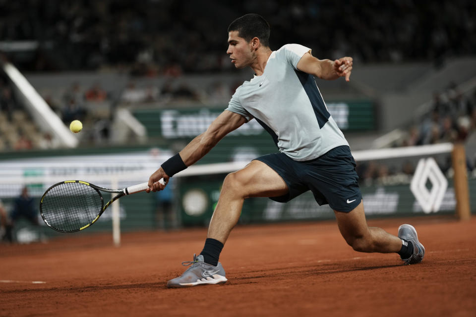 Spain's Carlos Alcaraz plays a shot against Sebastian Korda of the U.S. during their third round match at the French Open tennis tournament in Roland Garros stadium in Paris, France, Friday, May 27, 2022. (AP Photo/Thibault Camus)