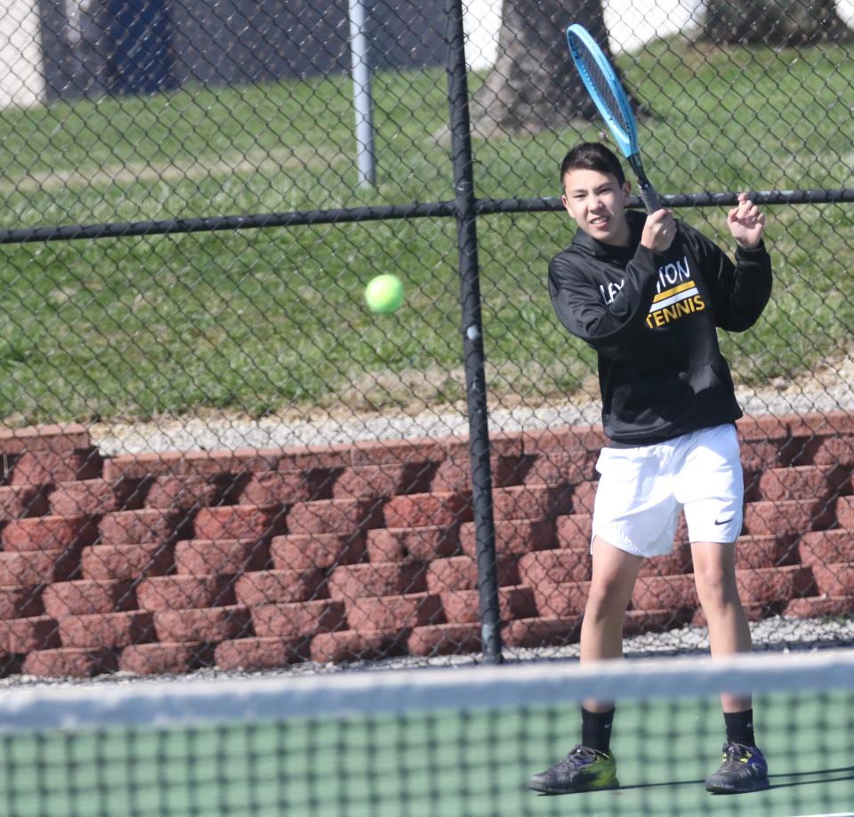 Lexington's Ethan Remy retuns a serve during a match with Ashland last spring. The Minutemen will look to compete at the state tournament in 2023 which has been move to OSU.