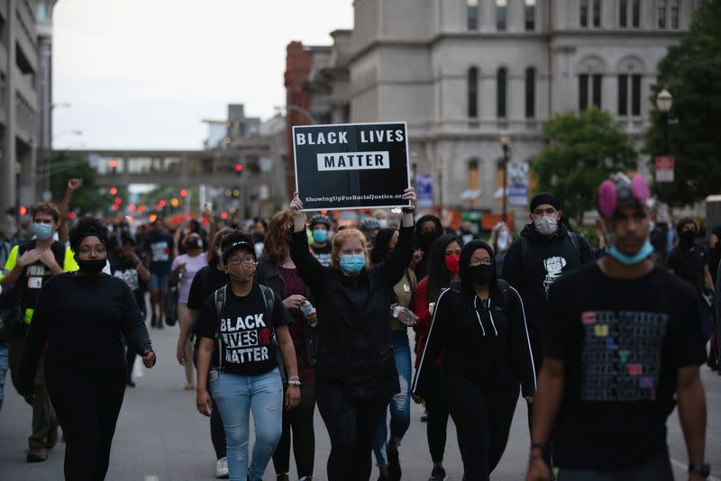 Protestors gather on the second day after a grand jury decided not to bring homicide charges against police officers involved in the fatal shooting of Breonna Taylor in her apartment, in Louisville