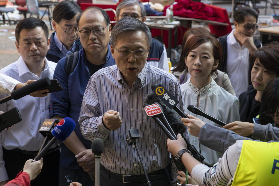 President of the Polytechnic University Jin-Guang Teng speaks to the media at the campus in Hong Kong on Wednesday, Nov. 20, 2019. A small group of protesters refused to leave the Polytechnic University, the remnants of hundreds who took over the campus for several days. They won't leave because they would face arrest. Police have set up a cordon around the area to prevent anyone from escaping. (AP Photo/Ng Han Guan)