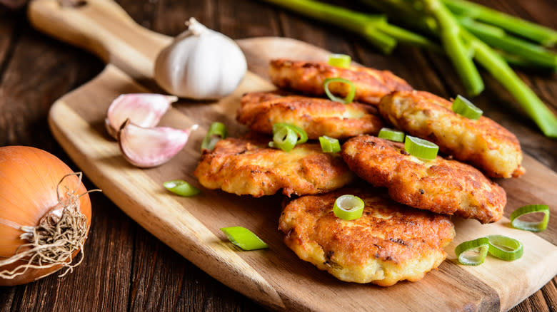 Fried tuna patties on a board