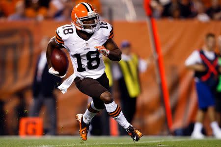 Cleveland Browns wide receiver Taylor Gabriel (18) returns a kick in the first quarter against the St. Louis Rams at FirstEnergy Stadium. Mandatory Credit: Rick Osentoski-USA TODAY Sports