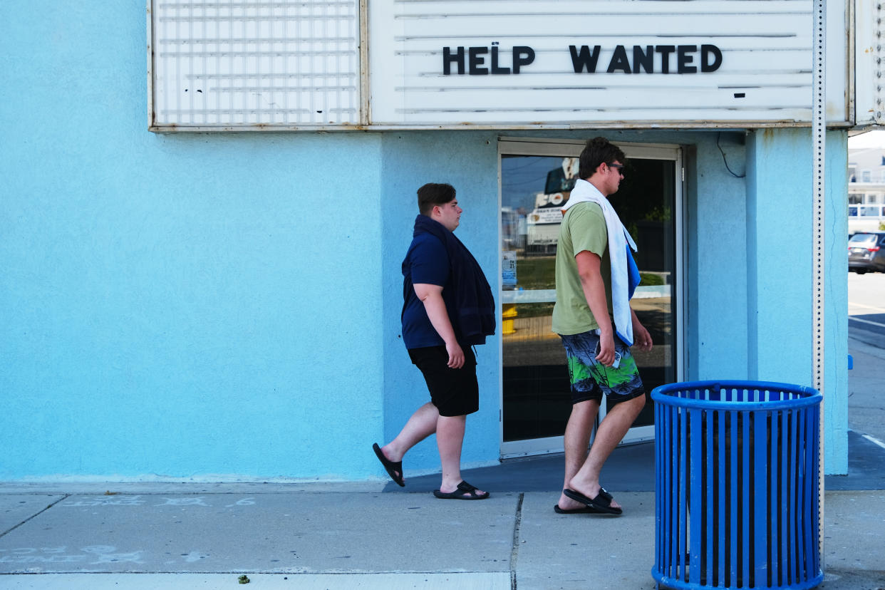 WILDWOOD, NEW JERSEY - MAY 27: A help wanted sign is displayed outside of a business near the boardwalk days before the Memorial Day weekend, the unofficial start of summer, in the shore community of Wildwood on May 27, 2021 in Wildwood, New Jersey. Wildwood, like many beach communities throughout the United States, is looking for a successful and busy summer season after staying mostly closed or partially open last summer due to Covid-19 restrictions. Many resort community retail businesses are also suffering from a shortage of labor as some workers are choosing to stay home and others have changed career paths.  (Photo by Spencer Platt/Getty Images)