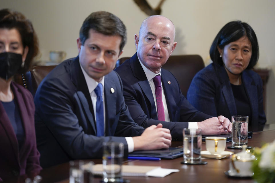 FILE - From left, Commerce Secretary Gina Raimondo, Transportation Secretary Pete Buttigieg, Homeland Security Secretary Alejandro Mayorkas and U.S. Trade Representative Katherine Tai listen as President Joe Biden holds a cabinet meeting at the White House, Jan. 5, 2023, in Washington. (AP Photo/Patrick Semansky, File)