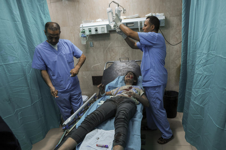 A Palestinian girl wounded during an Israeli airstrike receives medical treatment at al-Aqsa Hospital in Deir el-Balah, central Gaza Strip, Sunday, Oct. 15, 2023. (AP Photo/Adel Hana)