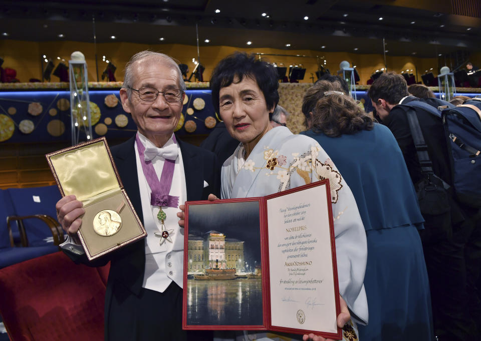 Chemistry laureate Akira Yoshino and his wife Kumiko pose with his Nobel medal and diploma during the Nobel Prize award ceremony at the Stockholm Concert Hall, in Stockholm, Tuesday, Dec. 10, 2019. (Jonas Ekstromer/TT News Agency via AP)