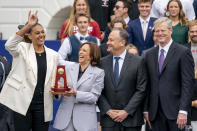 Logan Eggleston, member of the University of Texas at Austin's NCAA national championship-winning college volleyball team, stands with Vice President Kamala Harris, former Massachusetts Governor and NCAA President Charlie Baker, right, and Doug Emhoff, second from right, after presenting Harris with an NCAA Championship trophy during College Athlete Day on the South Lawn of the White House, Monday, June 12, 2023. (AP Photo/Andrew Harnik)