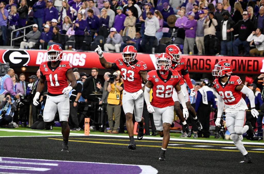  Georgia players celebrate an interception during the 2023 national championship game.  