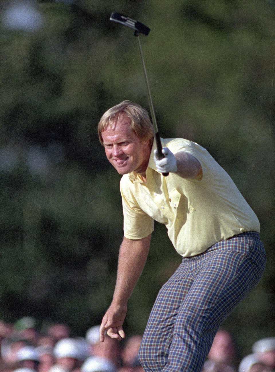 FILE - In this April 13, 1986, file photo, Jack Nicklaus watches his shot go for a birdie, giving him the lead and the title on the 17th hole at the Masters golf tournament in Augusta, Ga. There is no Masters this year because of the COVID-19 pandemic, the first time there is no golf at Augusta National the first full week in April since the end of World War II in 1945. (AP Photo/Joe Benton, File)