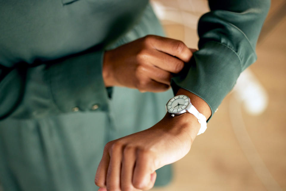 <em>A woman checking the time on her watch.</em><p>iStock</p>