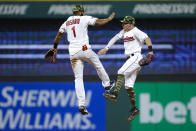 Cleveland Guardians' Amed Rosario (1) and Myles Straw celebrate a win over the Detroit Tigers in a baseball game, Friday, May 20, 2022, in Cleveland. (AP Photo/Ron Schwane)