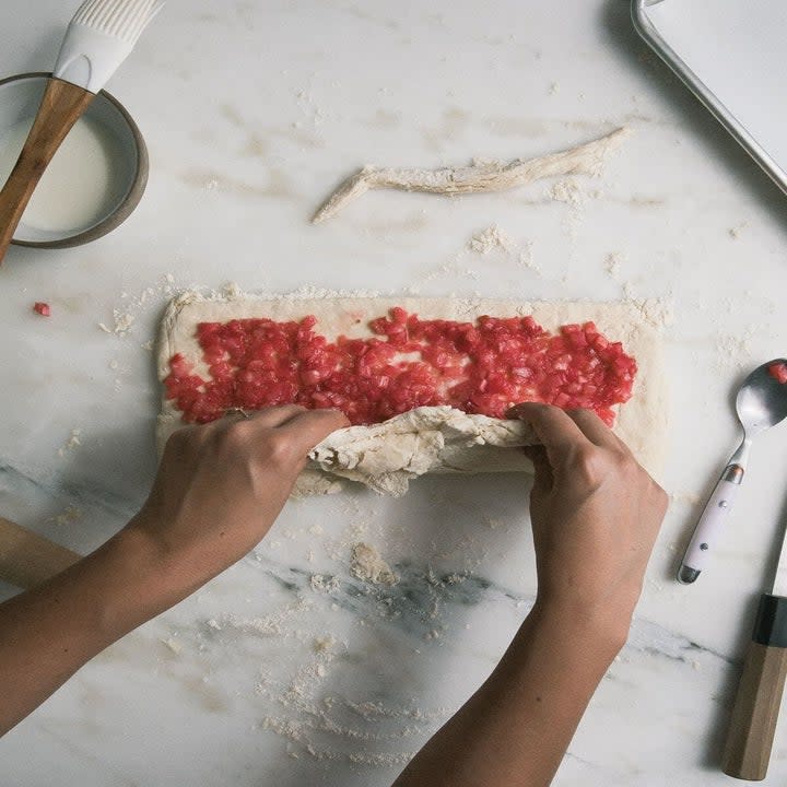 Rolling a rhubarb scone.