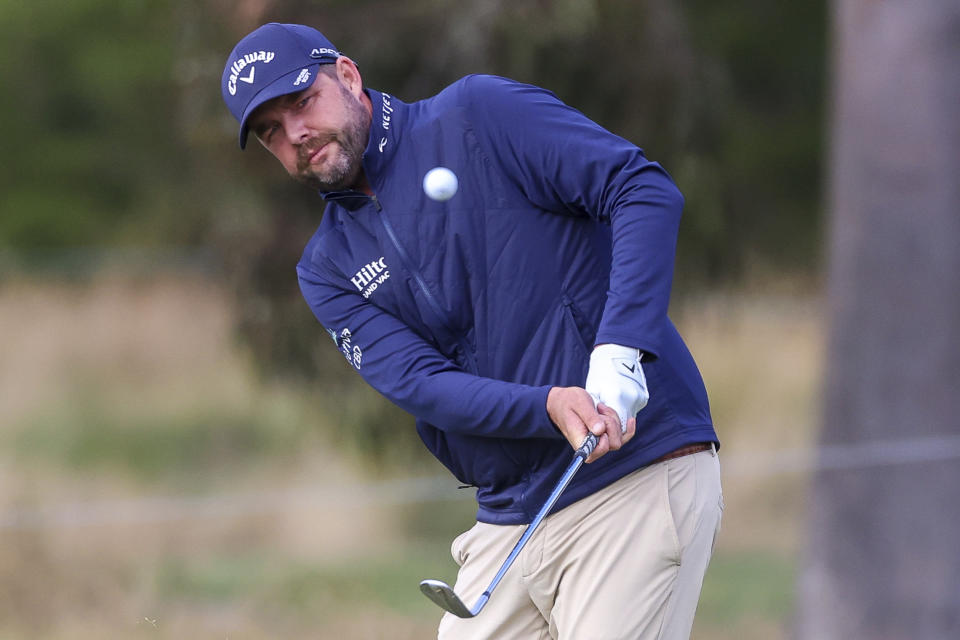 Australia's Marc Leishman plays a chip shot on the 13th hole during the Australian Open golf championship at Kingston Heath golf course in Melbourne, Australia, Friday, Dec. 2, 2022. (AP Photo/Asanka Brendon Ratnayake)