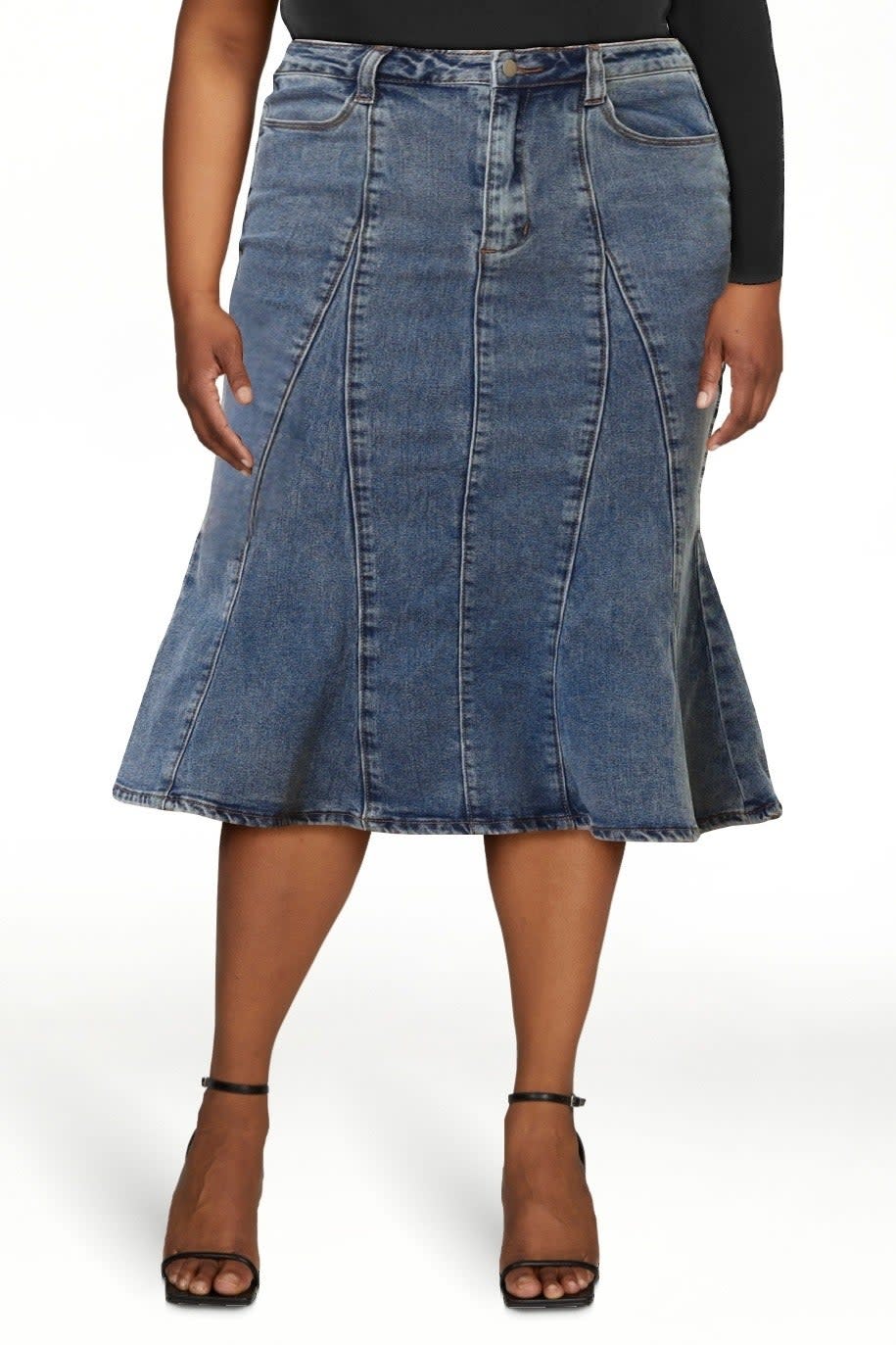 Person wearing a denim midi skirt with black top and strappy heels