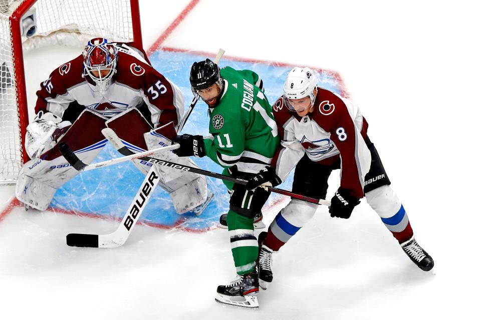 Dallas Stars center Andrew Cogliano (11) fights for position against Colorado Avalanche defenseman Cale Makar during the first period of Game 6.