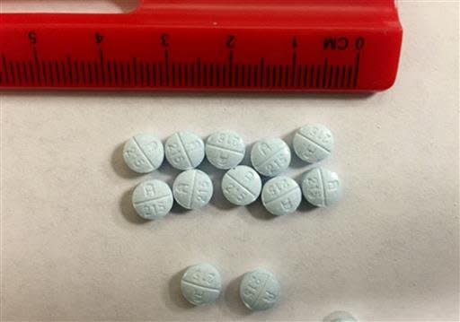 This undated photo provided by the Tennessee Bureau of Investigation shows fake Oxycodone pills that are actually fentanyl that were seized and submitted to bureau crime labs. Street fentanyl is increasingly dangerous to users, with thousands of deaths in recent years blamed on the man-made opiate. But police say officers are at risk, too, because the drug can be inhaled if powder becomes airborne, or it can be absorbed through the skin. Fentanyl is sometimes placed in tablets of counterfeit prescription drugs, but also comes in the form of patches, powder and even sprays. (Tommy Farmer/Tennessee Bureau of Investigation via AP)