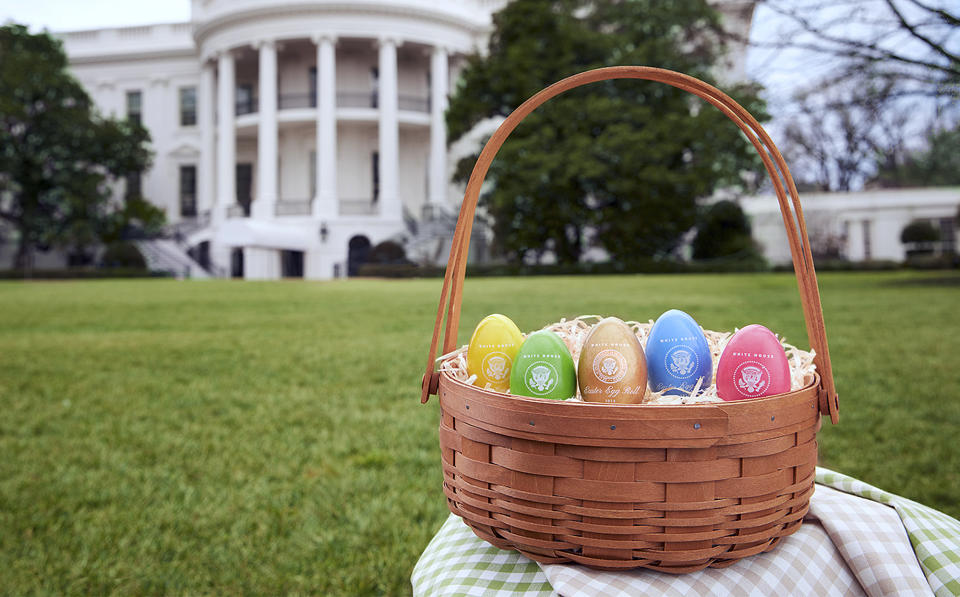 <p>In this 2018 photo provided by the White House Historical Association, colorful eggs created at Maine Wood Concepts in New Vineyard, Maine, are displayed outside the White House in Washington. Some of the 110,000 keepsakes created for the association will be used in the White House Easter Egg Roll on Monday, April 2. (Photo: David Wiegold/White House Historical Association via AP) </p>