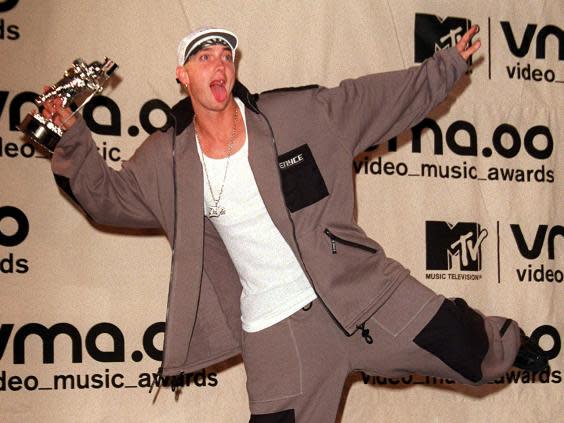 Eminem celebrates at the 2000 MTV Video Music Awards (Erik Pendzich/Shutterstock)